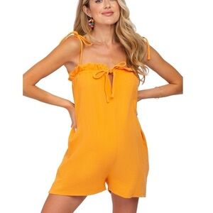 Lush Crinkle Orange Ruffle Cutout Front Tie Strap Oversized Short Romper